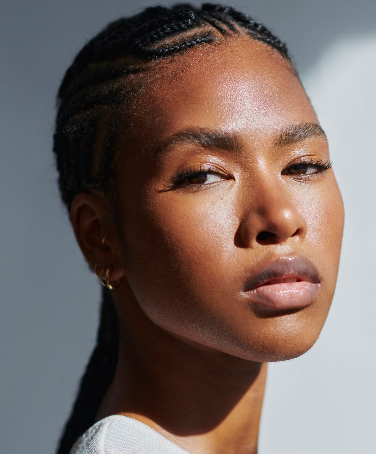 Close-up of person with braided hair.