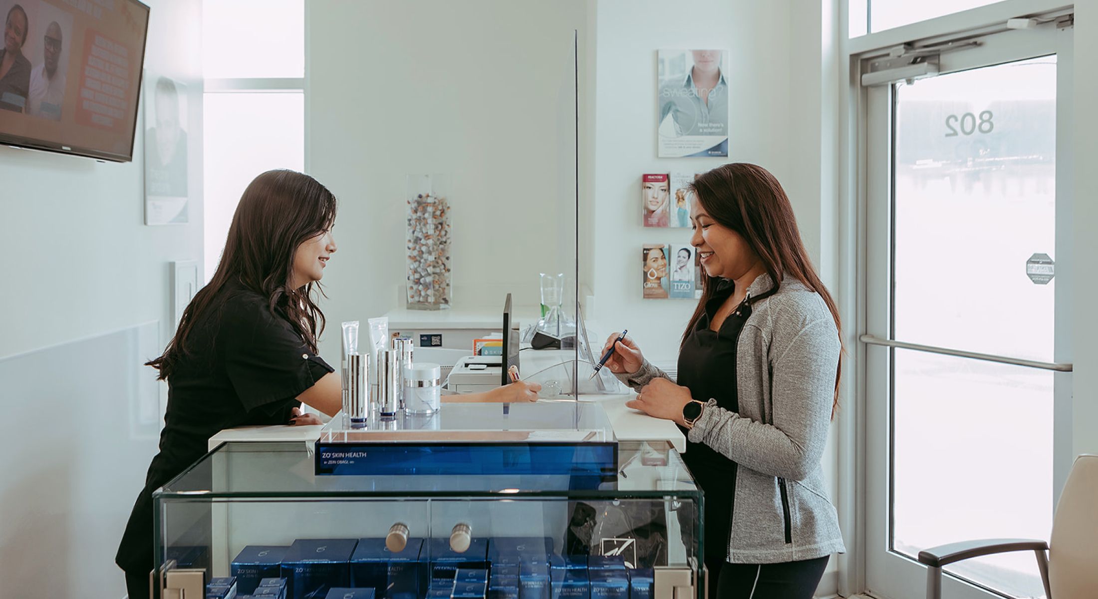 Customer service interaction at a skincare clinic.